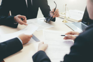 lawyers talking to employees