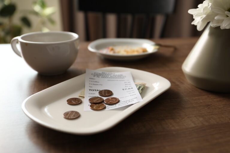 Coins and a receipt on a plate